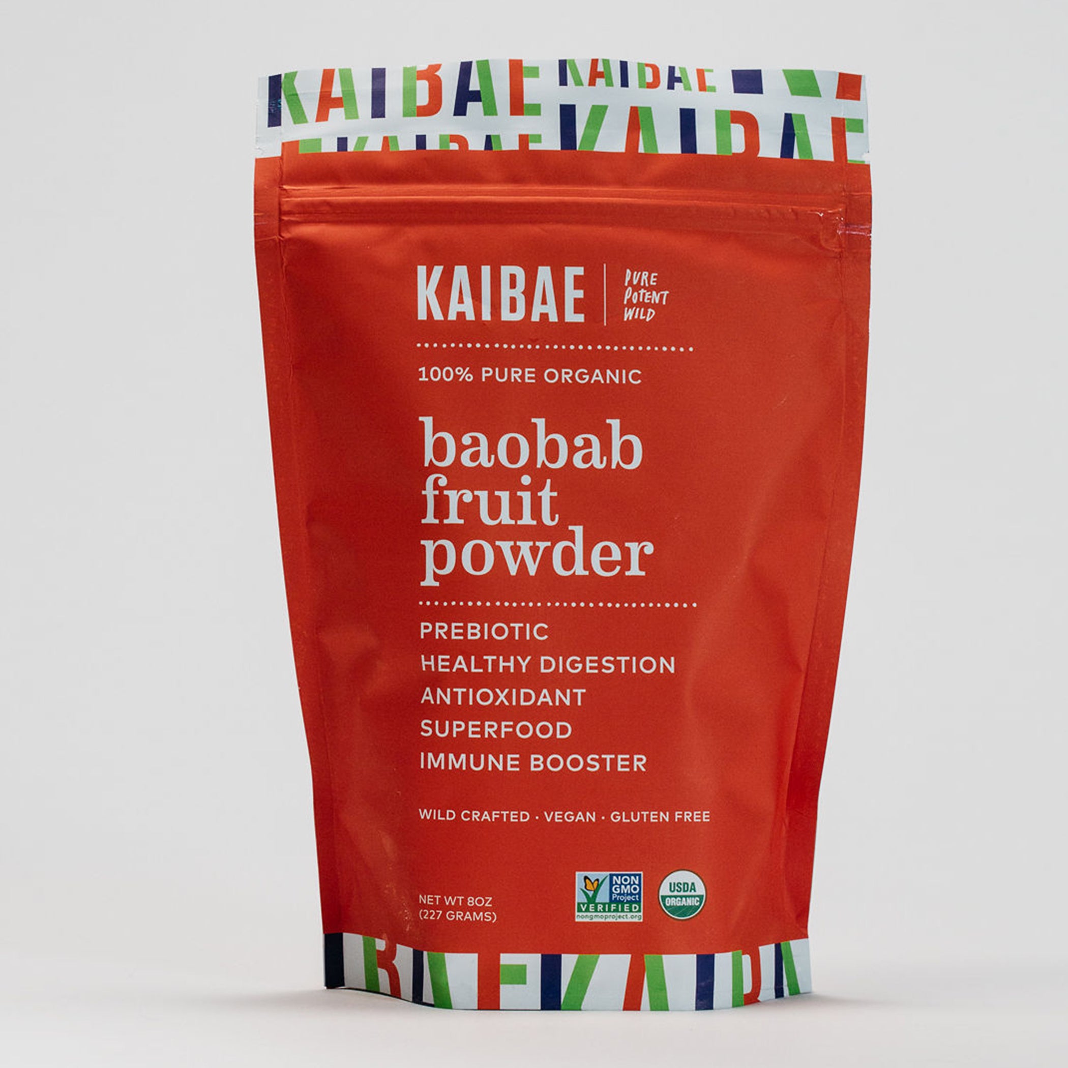 A red pouch of KAIBAE Baobab Powder stands against a white background. The packaging highlights it as 100% pure organic, prebiotic fiber, antioxidant, and vegan.